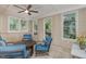 Cozy sunroom with tile floors, comfortable seating, and bright, natural light at 81008 Alexander, Chapel Hill, NC 27517
