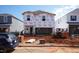 New two-story home under construction with Tyvek wrap and Bobcat machinery at 813 Ottawa Dr, Garner, NC 27529