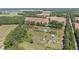 Aerial view of the property's surrounding area featuring homes and farmland at 8163 Julian Rd, Dunn, NC 28334