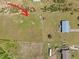 Aerial view showcasing property layout, with surrounding land and neighboring homes, highlighting the spacious environment at 8163 Julian Rd, Dunn, NC 28334