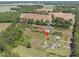 Aerial perspective of the area with surrounding properties and expansive fields at 8163 Julian Rd, Dunn, NC 28334