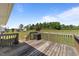 Overhead view of the back deck and large yard featuring multiple outbuildings and mature trees at 8163 Julian Rd, Dunn, NC 28334