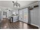 Cozy kitchenette area with a modern light fixture and french doors leading to the backyard at 8163 Julian Rd, Dunn, NC 28334