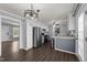 Cozy kitchen featuring white and gray cabinets, stainless steel appliances, and hardwood flooring at 8163 Julian Rd, Dunn, NC 28334