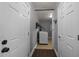 Laundry room hallway with washer hookups and neutral walls and a tile floor at 8163 Julian Rd, Dunn, NC 28334