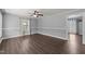 Bright living room featuring laminate flooring, neutral walls, and a ceiling fan at 8163 Julian Rd, Dunn, NC 28334