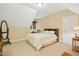 Cozy bedroom featuring soft carpet, natural light, and comfortable furnishings at 10011 Hammock Bnd, Chapel Hill, NC 27517