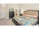 Bedroom with view to bathroom featuring large bedframe and chest of drawers at 10011 Hammock Bnd, Chapel Hill, NC 27517