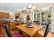 Eat-in kitchen area features a wood table, seating for four, and access to the back yard through sliding glass doors at 10011 Hammock Bnd, Chapel Hill, NC 27517