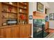 Fireplace featuring custom built-in shelving and cabinets at 10011 Hammock Bnd, Chapel Hill, NC 27517