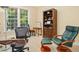 Office includes window seat and custom bookshelf at 10011 Hammock Bnd, Chapel Hill, NC 27517