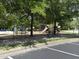 Outdoor playground with slides, climbers, and swings at 10011 Hammock Bnd, Chapel Hill, NC 27517