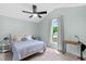 Comfortable bedroom with vaulted ceiling, ample natural light, and ceiling fan at 109 N Valley Dr, Louisburg, NC 27549