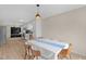Open-concept dining room leading to the kitchen, perfect for entertaining, with natural lighting at 109 N Valley Dr, Louisburg, NC 27549