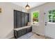 Welcoming entryway with a mudroom bench and ample storage for coats and shoes at 109 N Valley Dr, Louisburg, NC 27549