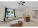 Well-lit living room featuring a sofa, modern furnishings, and bright accents at 109 N Valley Dr, Louisburg, NC 27549
