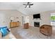 Spacious living room boasting ample seating, a fireplace, and stylish decor at 109 N Valley Dr, Louisburg, NC 27549