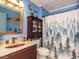 Bathroom displaying a unique sink and a shower with a forest-themed curtain at 112 Cameron Ct, Cary, NC 27511