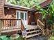 A covered porch featuring a wooden deck with steps up to the front door at 112 Cameron Ct, Cary, NC 27511