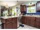 Kitchen featuring wooden cabinets, stainless steel appliances, and granite countertops at 112 Cameron Ct, Cary, NC 27511