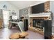 Comfortable living room showcases a fireplace and bright window at 112 Cameron Ct, Cary, NC 27511