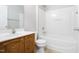 Full bathroom featuring a vanity with storage, a toilet, and a bathtub with shower at 11710 Mezzanine Dr # 101, Raleigh, NC 27614