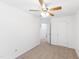 Neutral bedroom with a ceiling fan, large closet and a door leading to other rooms at 11710 Mezzanine Dr # 101, Raleigh, NC 27614