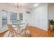 Charming dining room featuring a glass-top table, modern chairs, and ample natural light at 11710 Mezzanine Dr # 101, Raleigh, NC 27614