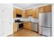 Modern kitchen with stainless steel appliances, granite countertops, and ample cabinet space at 11710 Mezzanine Dr # 101, Raleigh, NC 27614