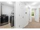 Laundry area with modern washer and dryer, and neutral-toned walls at 11710 Mezzanine Dr # 101, Raleigh, NC 27614