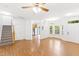 Spacious living area showcasing hardwood floors, natural light, open floor plan, and staircase at 11710 Mezzanine Dr # 101, Raleigh, NC 27614