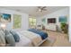 Beautifully staged main bedroom with calming colors and beach decor at 11710 Mezzanine Dr # 101, Raleigh, NC 27614
