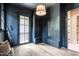 Walk-in closet featuring custom cabinets, drawers, and bench seating with a view of the backyard at 1222 Duplin Rd, Raleigh, NC 27607