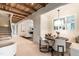 Charming dining area with a built-in bench, wood table and travertine flooring at 1222 Duplin Rd, Raleigh, NC 27607