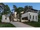 Stunning two-story home featuring a painted brick exterior, dark trim, manicured lawn and driveway at 1222 Duplin Rd, Raleigh, NC 27607