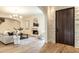 Cozy living room with fireplace, stone accents, wood flooring, and modern decor at 1222 Duplin Rd, Raleigh, NC 27607