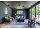 This living room features hardwood floors, dark walls, recessed lighting, and a ceiling fan at 1222 Duplin Rd, Raleigh, NC 27607