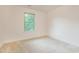 Bedroom featuring neutral walls, carpeted floors, and natural light from the window at 124 Owensboro Ct, Raleigh, NC 27603