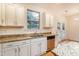 Kitchen boasts granite countertops, stainless steel appliances, and ample cabinet space at 124 Owensboro Ct, Raleigh, NC 27603