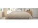 Comfortable bedroom with neutral tones, twin nightstands, and a decorative cloud pillow for a cozy aesthetic at 1244 Hazelnut Ridge Ln, Knightdale, NC 27545