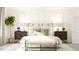Chic bedroom with light wood accents, patterned bedside tables, and unique art at 1244 Hazelnut Ridge Ln, Knightdale, NC 27545