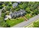 Aerial view of an estate home showcasing a meticulously maintained lawn and thoughtfully designed landscaping at 129 Trellingwood Dr, Morrisville, NC 27560