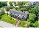 Aerial view of stately home with lush landscaping, mature trees, and a meticulously maintained yard at 129 Trellingwood Dr, Morrisville, NC 27560