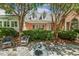 Serene backyard setting featuring a fountain and manicured landscaping at 129 Trellingwood Dr, Morrisville, NC 27560