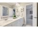 Bathroom with a double vanity, white marble countertop, and decorative fixtures at 129 Trellingwood Dr, Morrisville, NC 27560