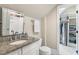 A spacious bathroom featuring granite counters, a walk in closet, and neutral tones creating a clean, modern aesthetic at 129 Trellingwood Dr, Morrisville, NC 27560