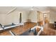 An expansive bonus room with hardwood floors, natural light and ample space for fitness and recreation at 129 Trellingwood Dr, Morrisville, NC 27560
