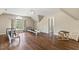 Spacious bonus room with hardwood floors, natural light, and a serene exercise area, great for fitness and leisure at 129 Trellingwood Dr, Morrisville, NC 27560