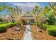 Charming brick home with lush landscaping, a walkway, and a welcoming entrance at 129 Trellingwood Dr, Morrisville, NC 27560