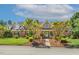 Beautiful brick home featuring a manicured lawn, professional landscaping, and inviting front entrance at 129 Trellingwood Dr, Morrisville, NC 27560